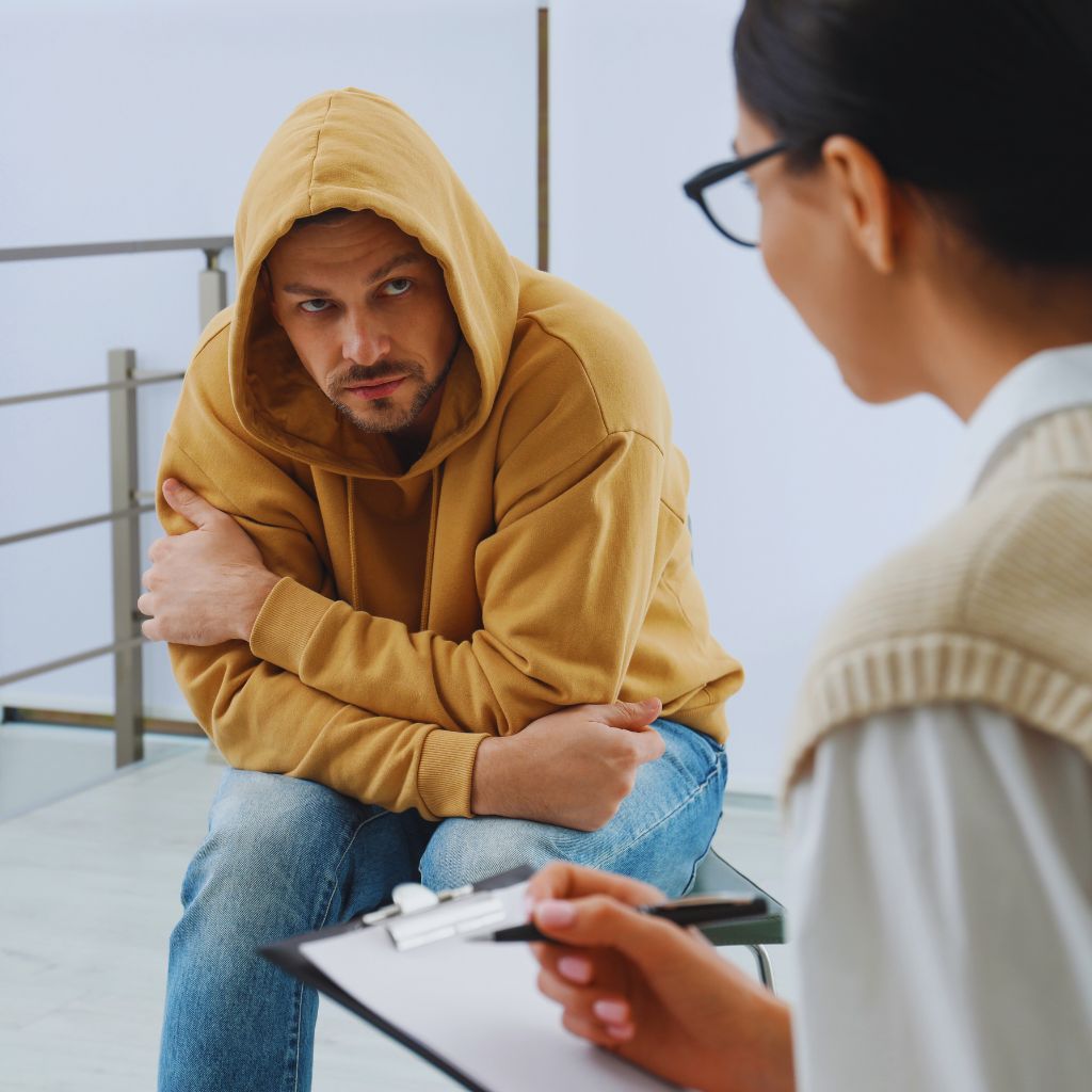 A-female-lie-detect-examiner-asking questions-from-a-male-about-his-drug-addiction-habits